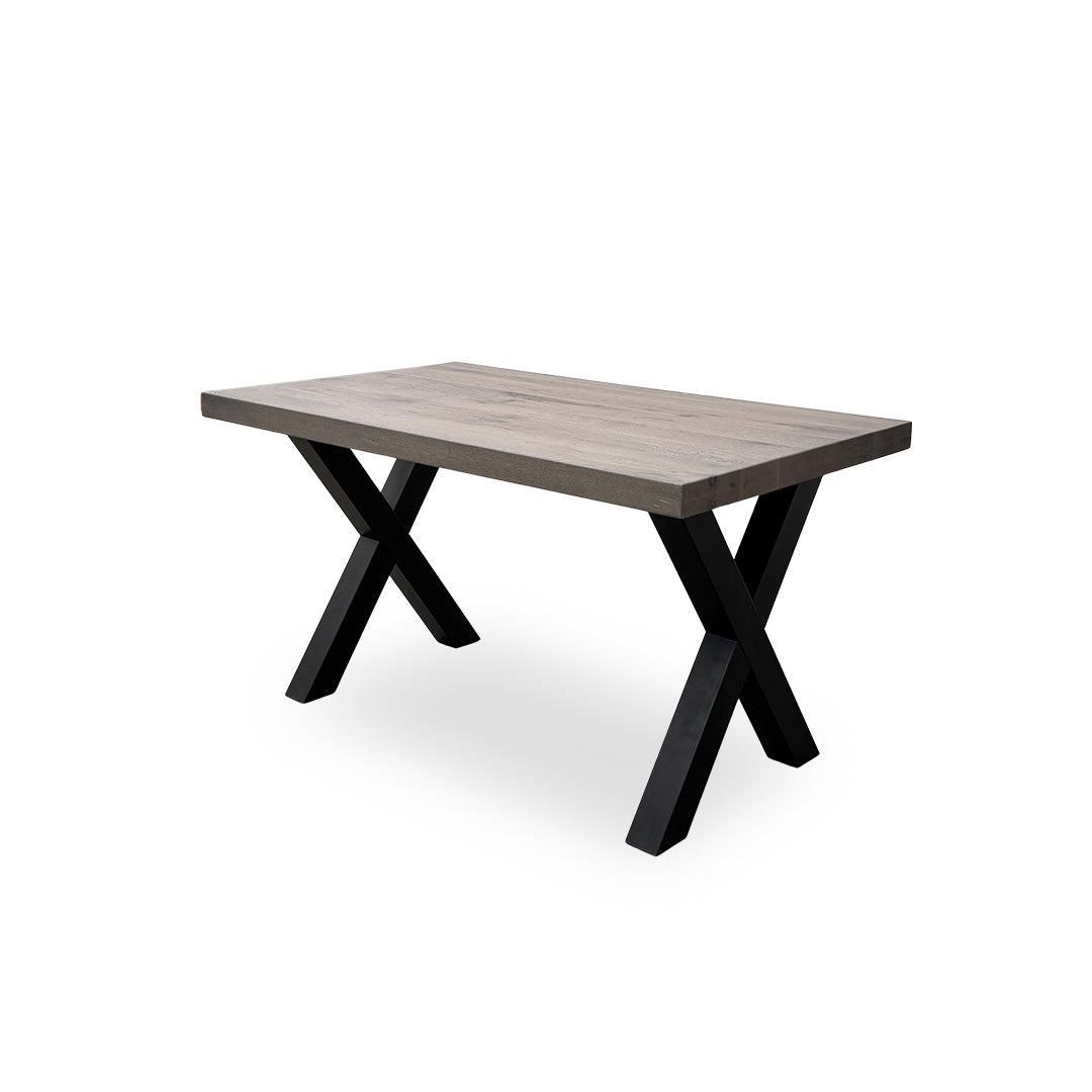 Low-angle shot focusing on the sturdy black metal X-shaped legs and the industrial structural design.