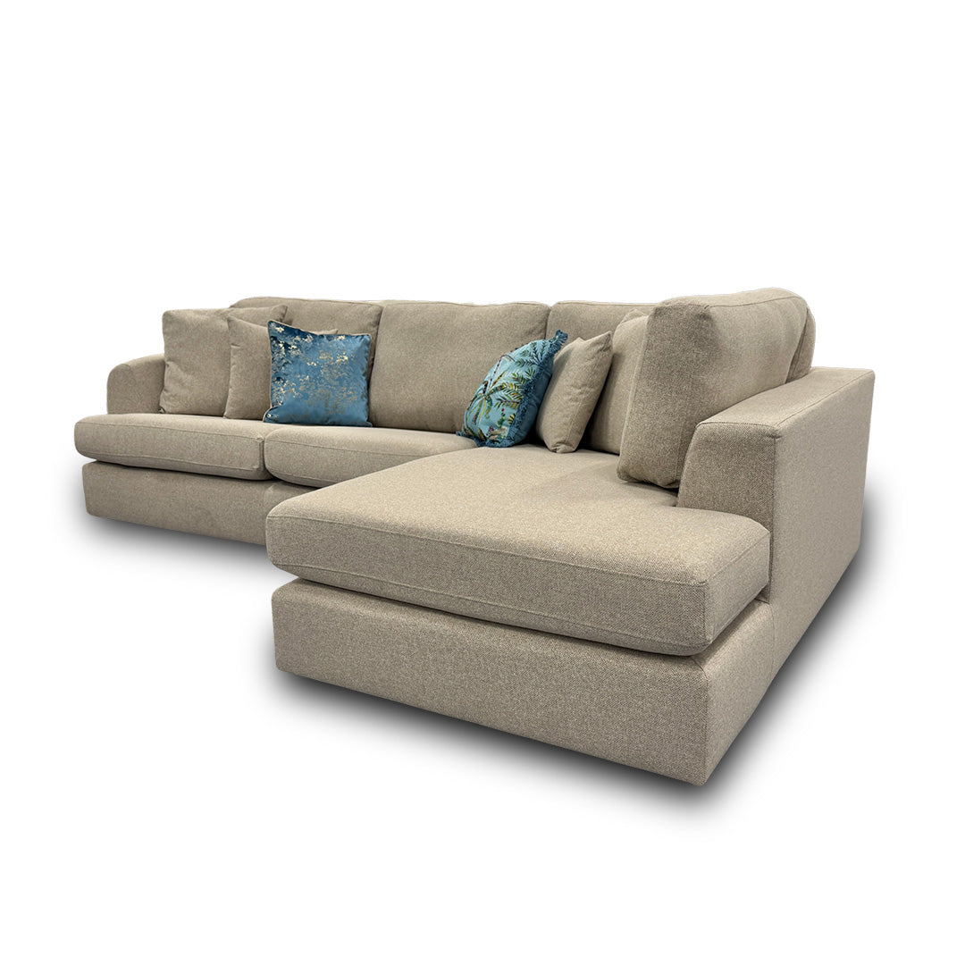 Side view emphasizing the modern back style, plump foam filling, and shelter arm design of the Stratus sofa.