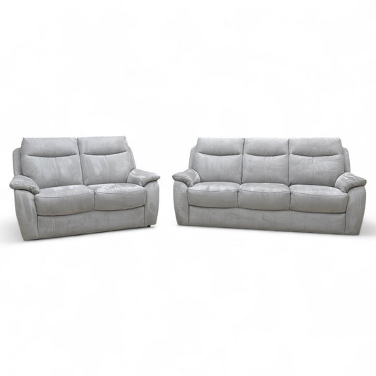 The Snug bluish-grey heavy-duty suede 3-piece sofa set, featuring a 3-seater and a 2-seater arranged in a modern living room.