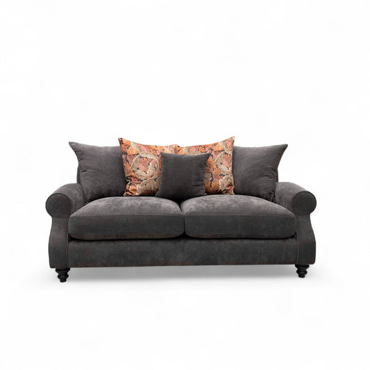 Gray sofa with decorative pillows on a white background