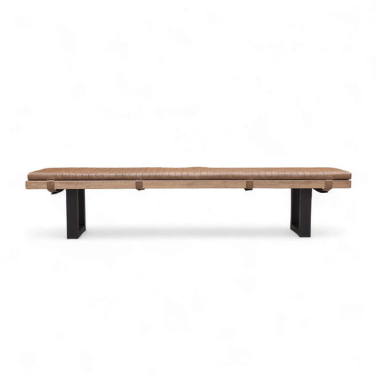 Long brown bench with black legs on a white background