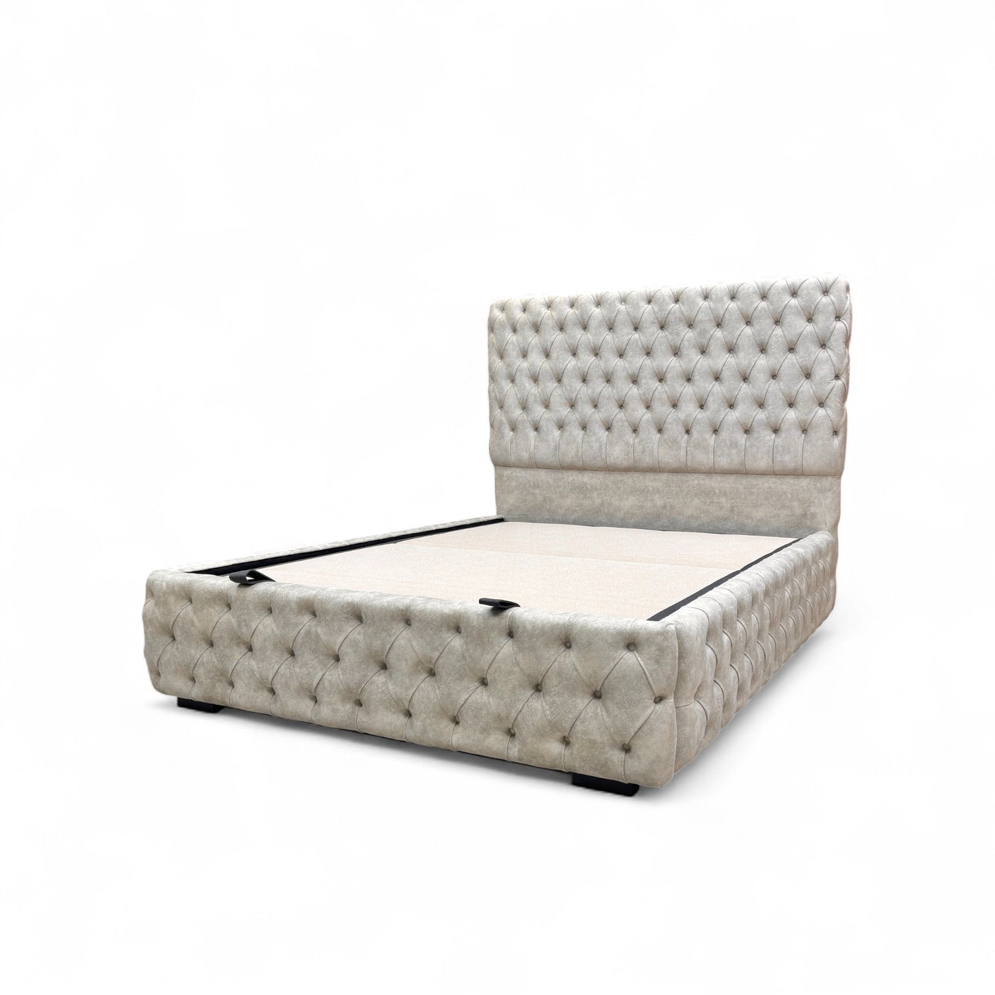 Side profile view of the Belford velvet bed, showing the full height of the floor-standing headboard and the streamlined base.