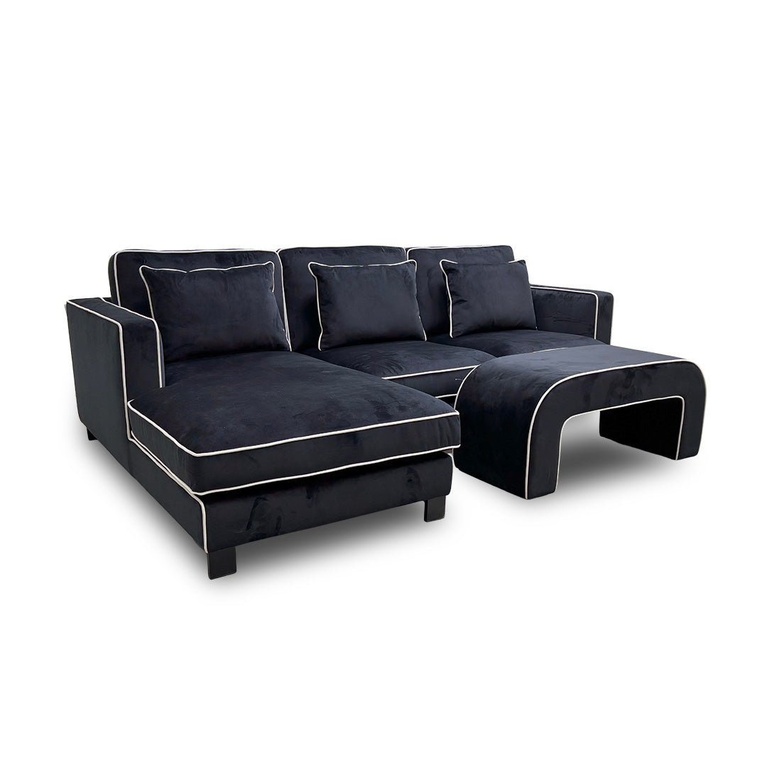 ‘Demure' Black Demure Velvet Left Hand Facing Arm 4 Seater Chaise Sofa + Banquette Footstool