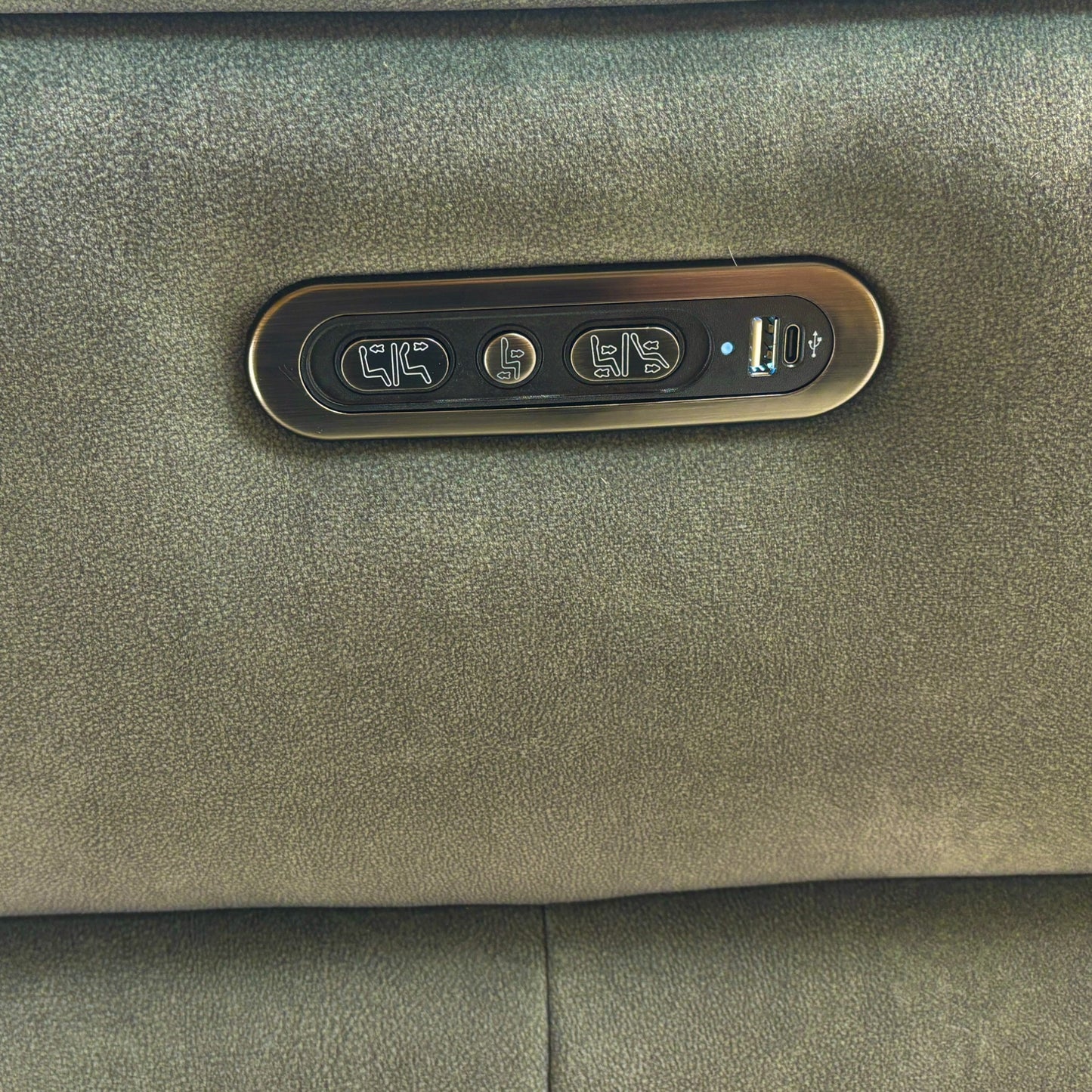 Detail shot of the power headrest on the corner unit, showing the smooth, adjustable mechanism and the soft velvet upholster