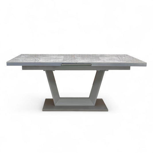 Close-up of the Grigio ceramic tabletop, showcasing the realistic gray and white veining of the marble effect.