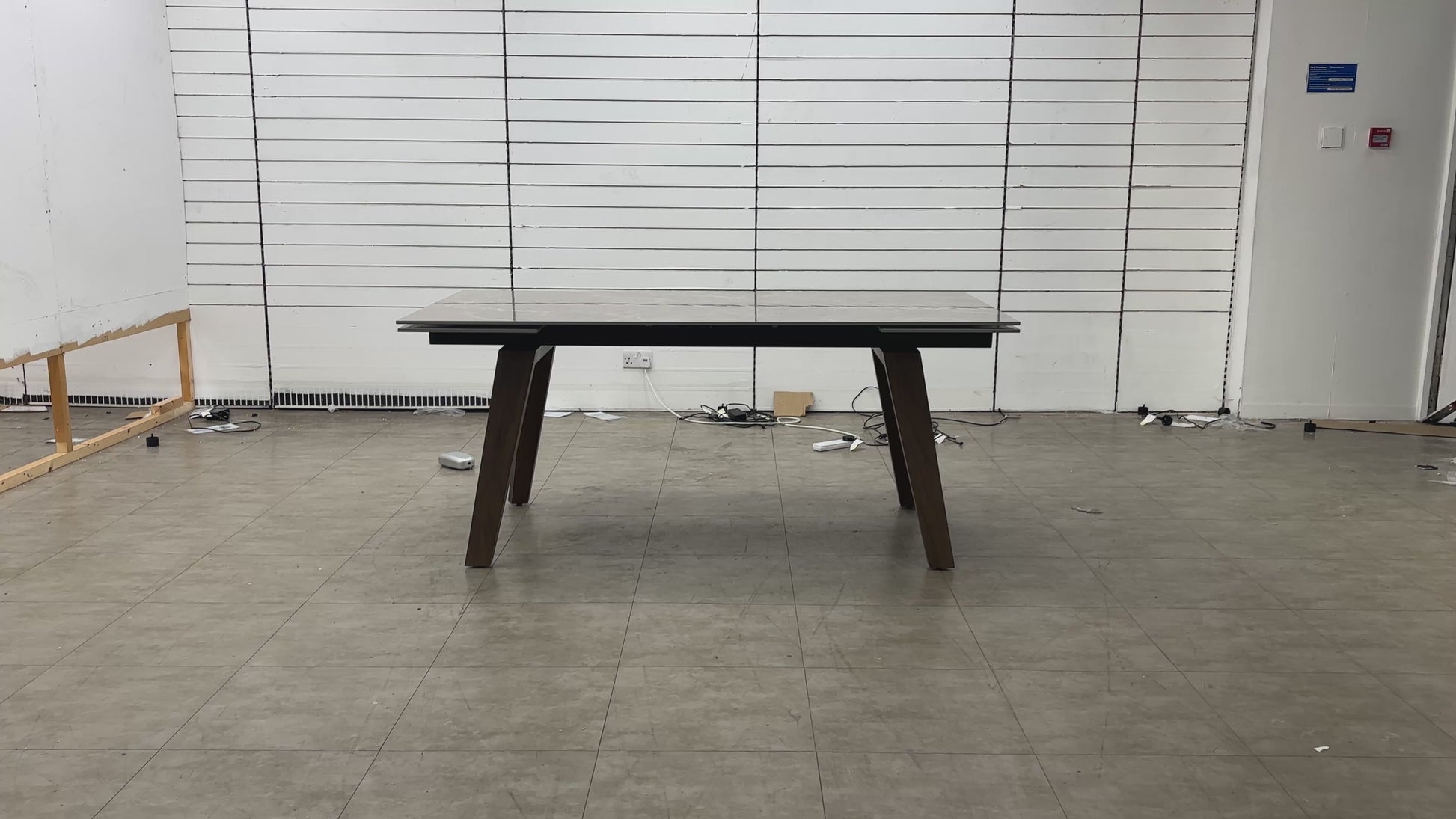 The Pierre dining table in its closed position, showcasing a compact profile ideal for everyday use.