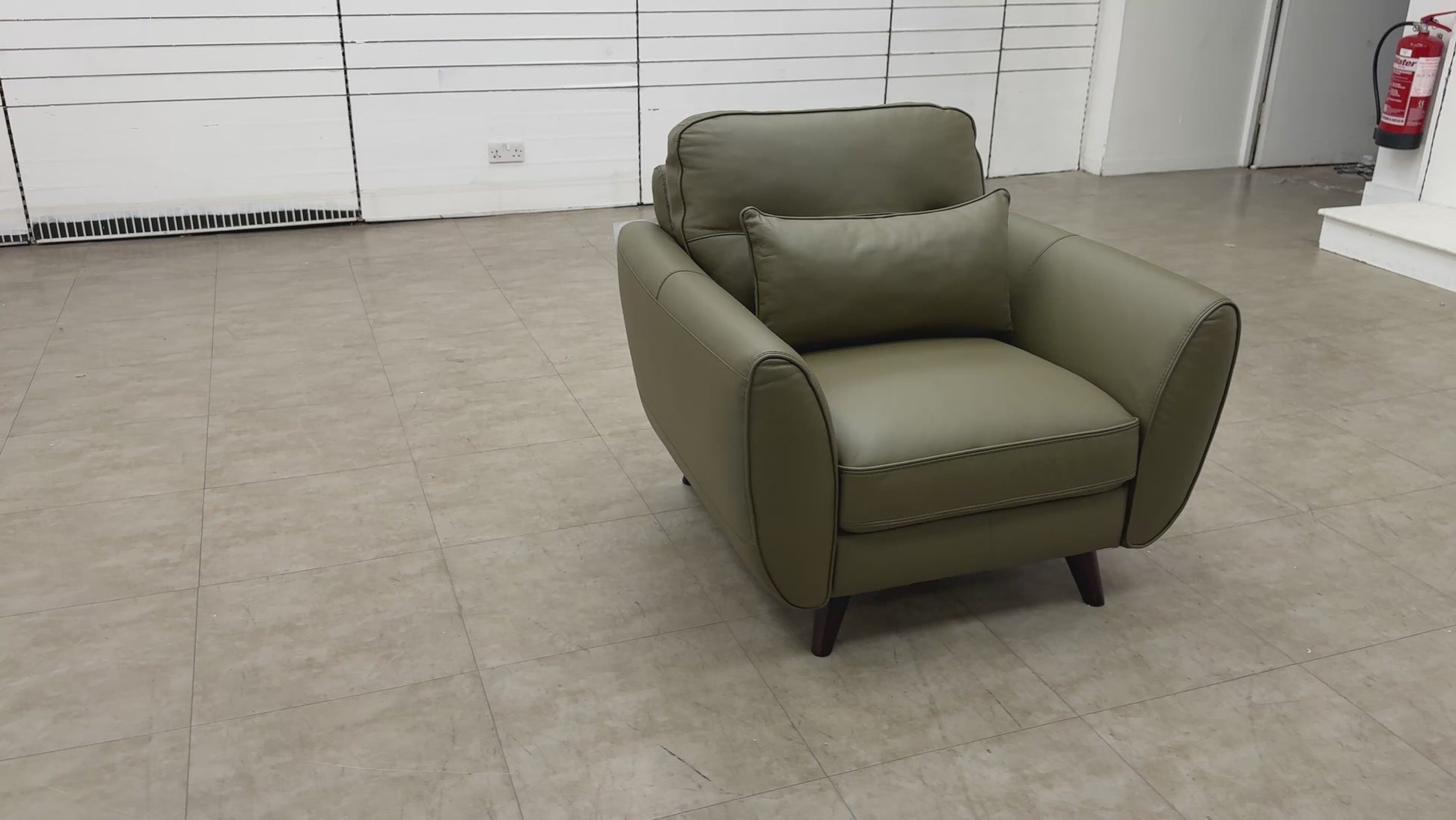 Video demonstration of the Fabb 'Ava' khaki green leather armchair, highlighting the leather quality and modern design.