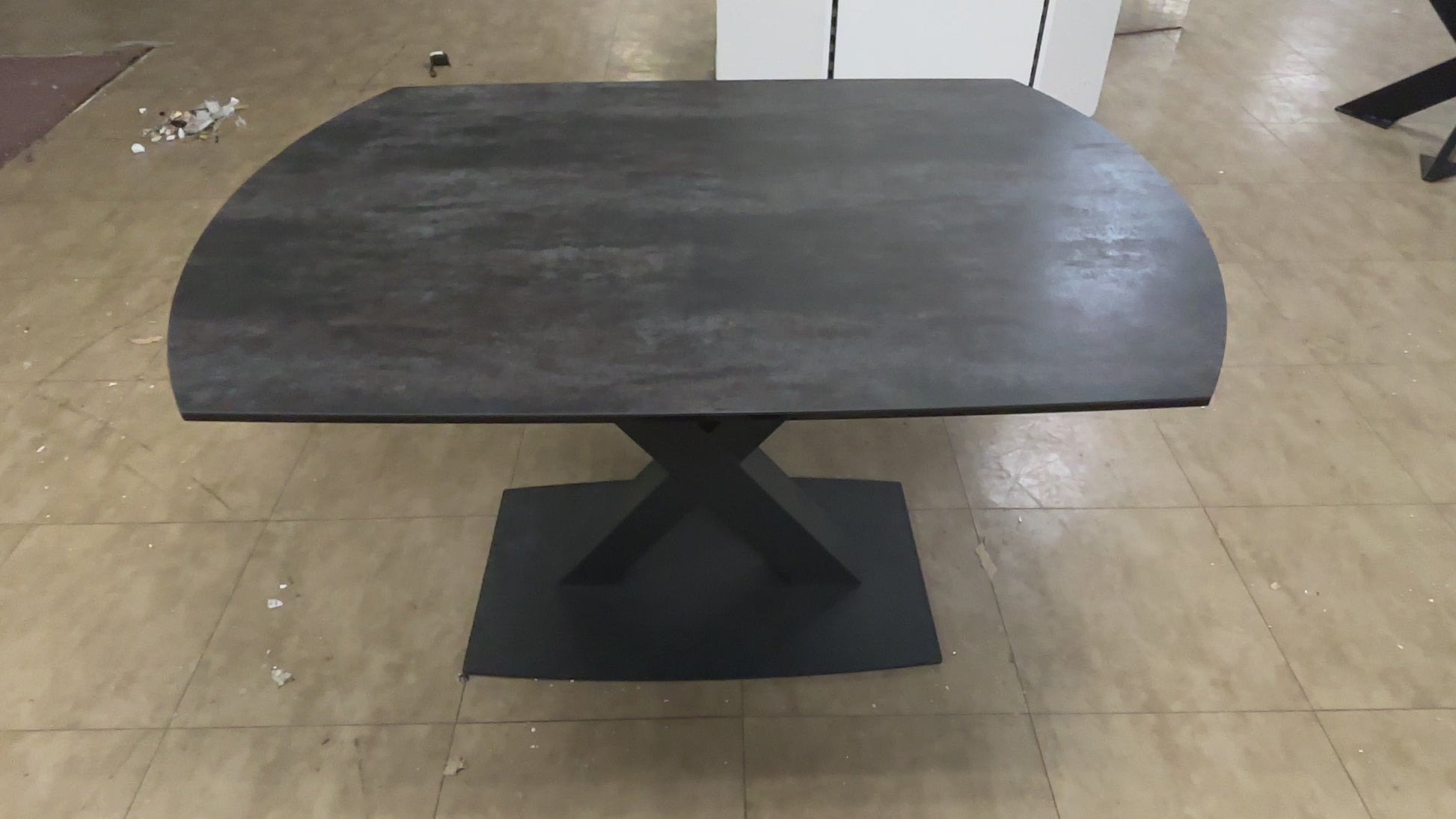 A video of a Modern dining table with a dark wood finish