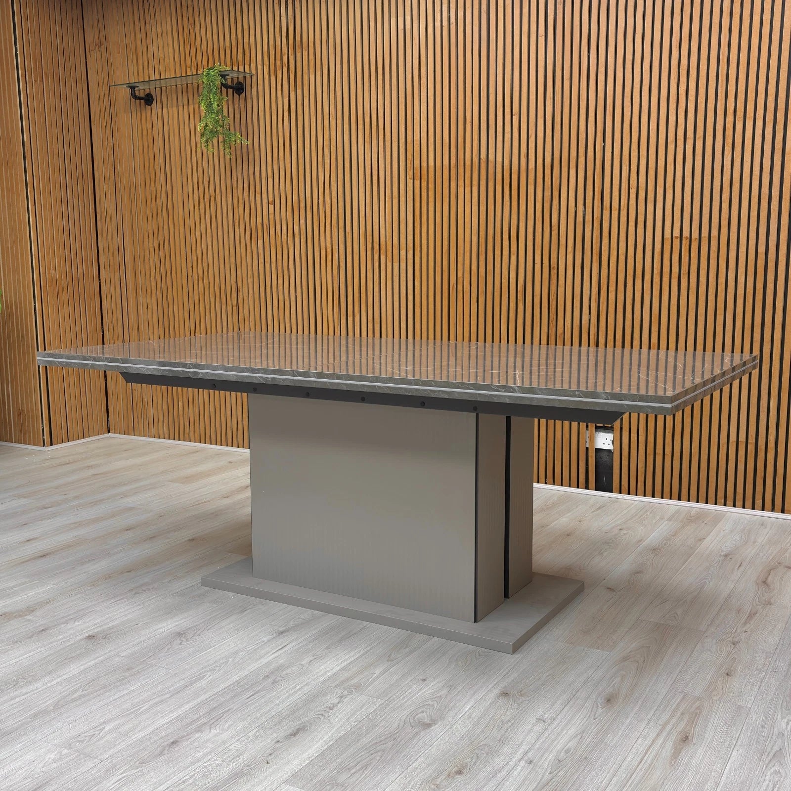 Lifestyle shot of the 'Lusso' Extending Dining Table with chairs, highlighting its size and modern glam style in a dining room setting.