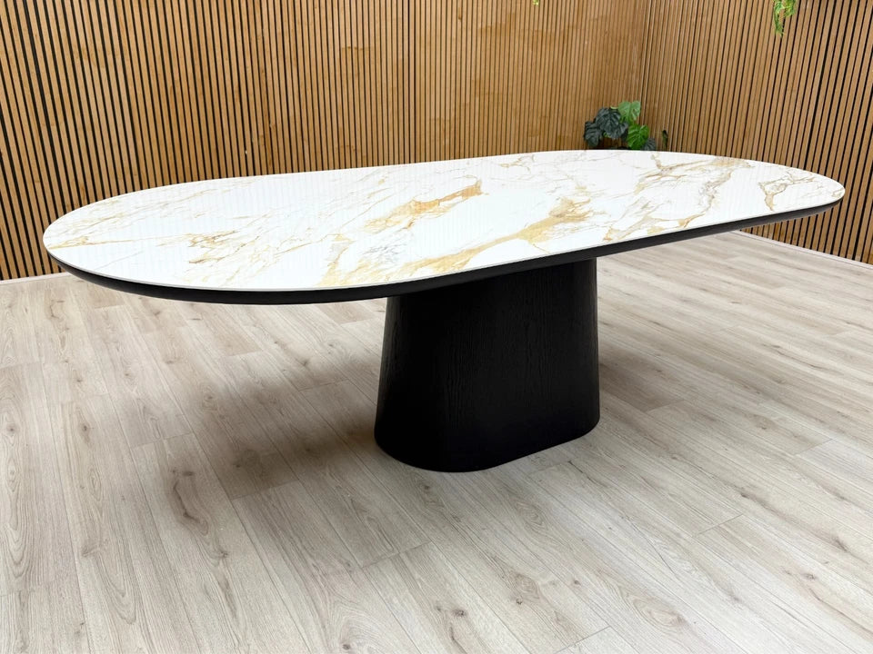 Close-up texture detail of the smooth, glossy white ceramic tabletop with a realistic grey marble-effect pattern.