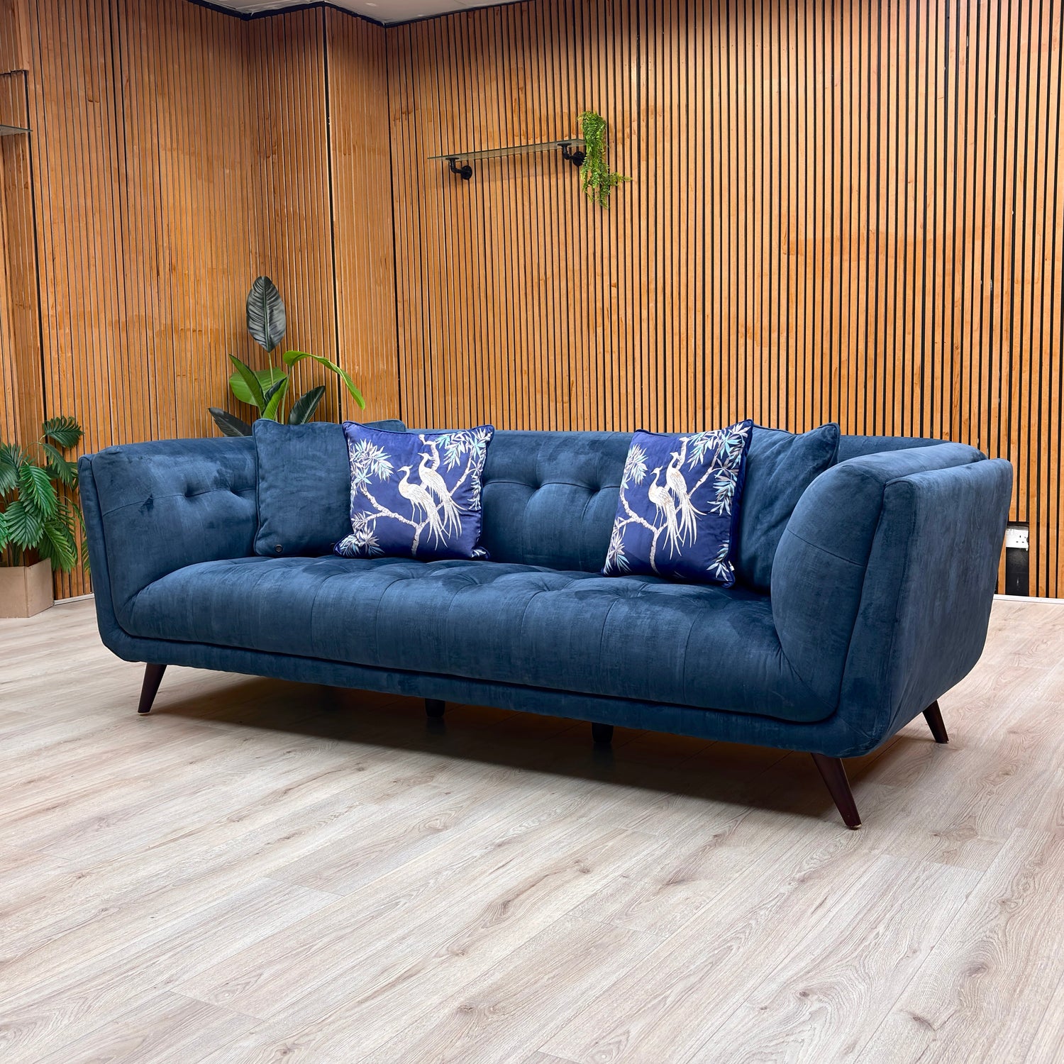 A diverse collection of three-seater sofas, featuring modern, traditional, and transitional designs in fabric and leather.