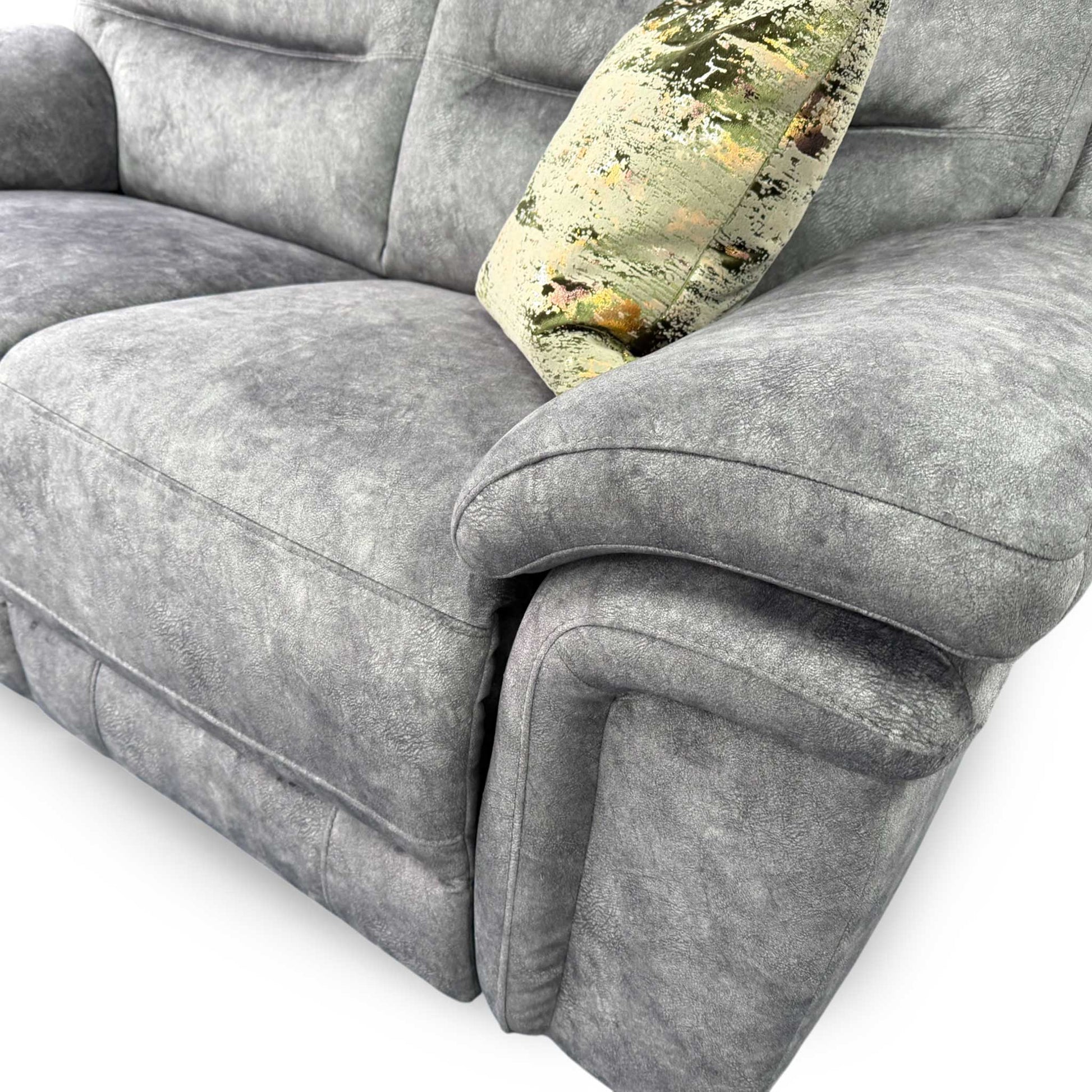 Close-up detail of the padded armrest and stitching, emphasizing the quality finish of the velvet fabric.