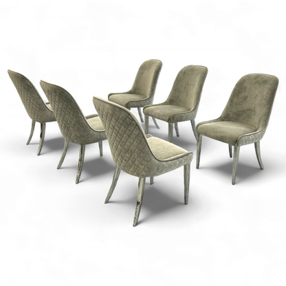 Angled shot of the 'Gabana' chair's padded seat and low, curved armrests.