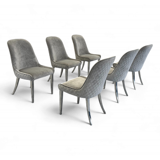 Full view of the 'Gabana' dining chair, upholstered in stone-colored plush velvet fabric with a rounded backrest and black metal legs.