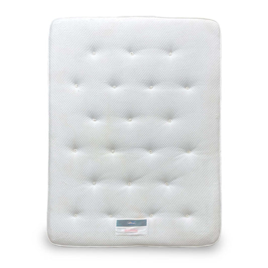 Wide-angle shot of the Lottie Wool Tuft & Snooze King Mattress, showing the plush tufted white surface.