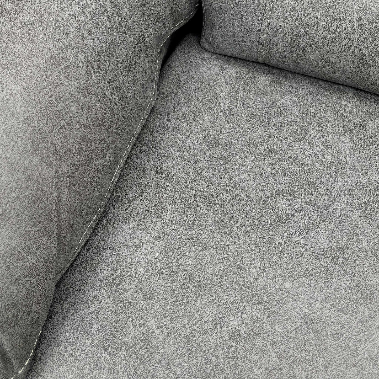 Close-up of the Grey Endurance Fabric texture on the sofa cushion, showing the durable material and neat contrast stitching.