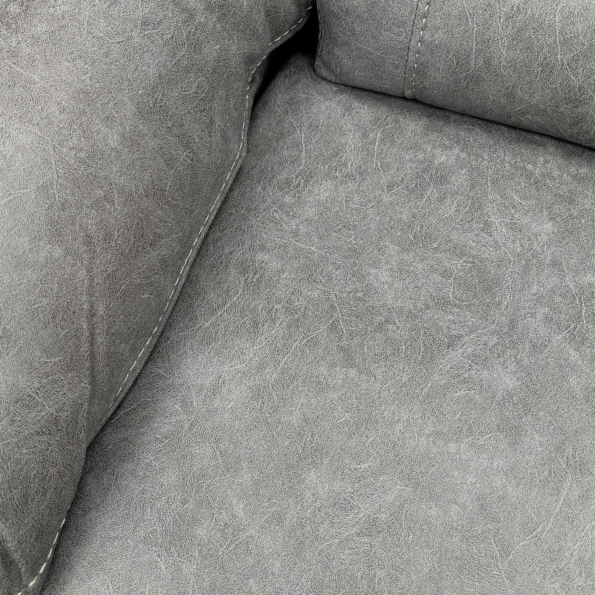 Close-up of the Grey Endurance Fabric texture on the sofa cushion, showing the durable material and neat contrast stitching.