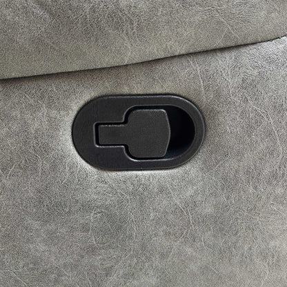 Detail shot of the black manual handle or latch used to operate the footrest and recliner mechanism on the side of the sofa.