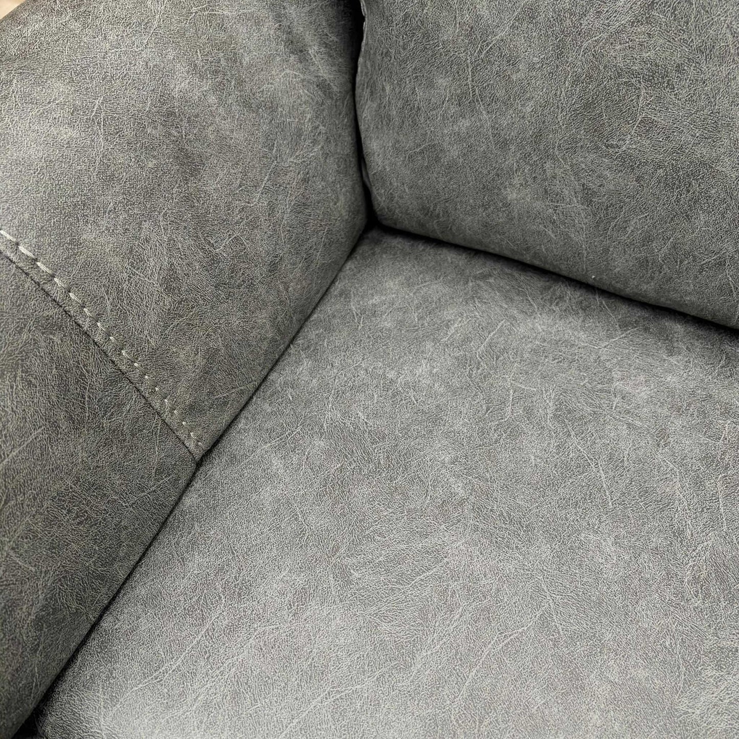 Close-up of the grey endurance fabric texture, illustrating the durable weave and soft finish.