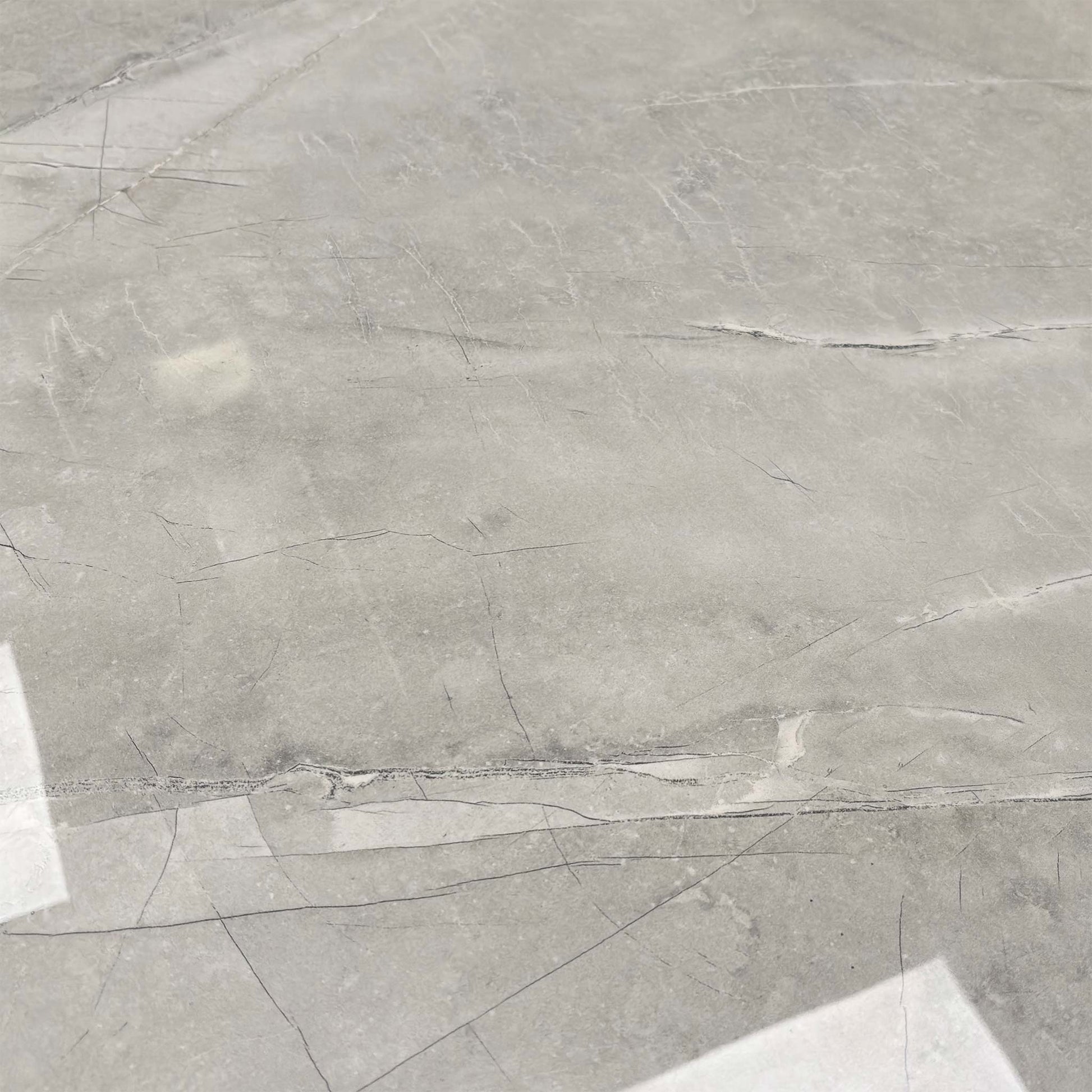 Close-up of the high-gloss ceramic finish, highlighting the realistic grey marble veining and durable texture.