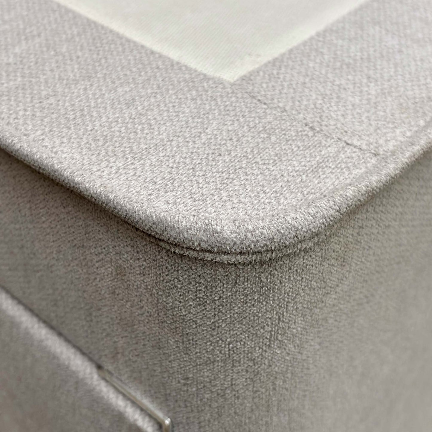Side view of the divan base with one drawer pulled open, demonstrating the built-in storage space.