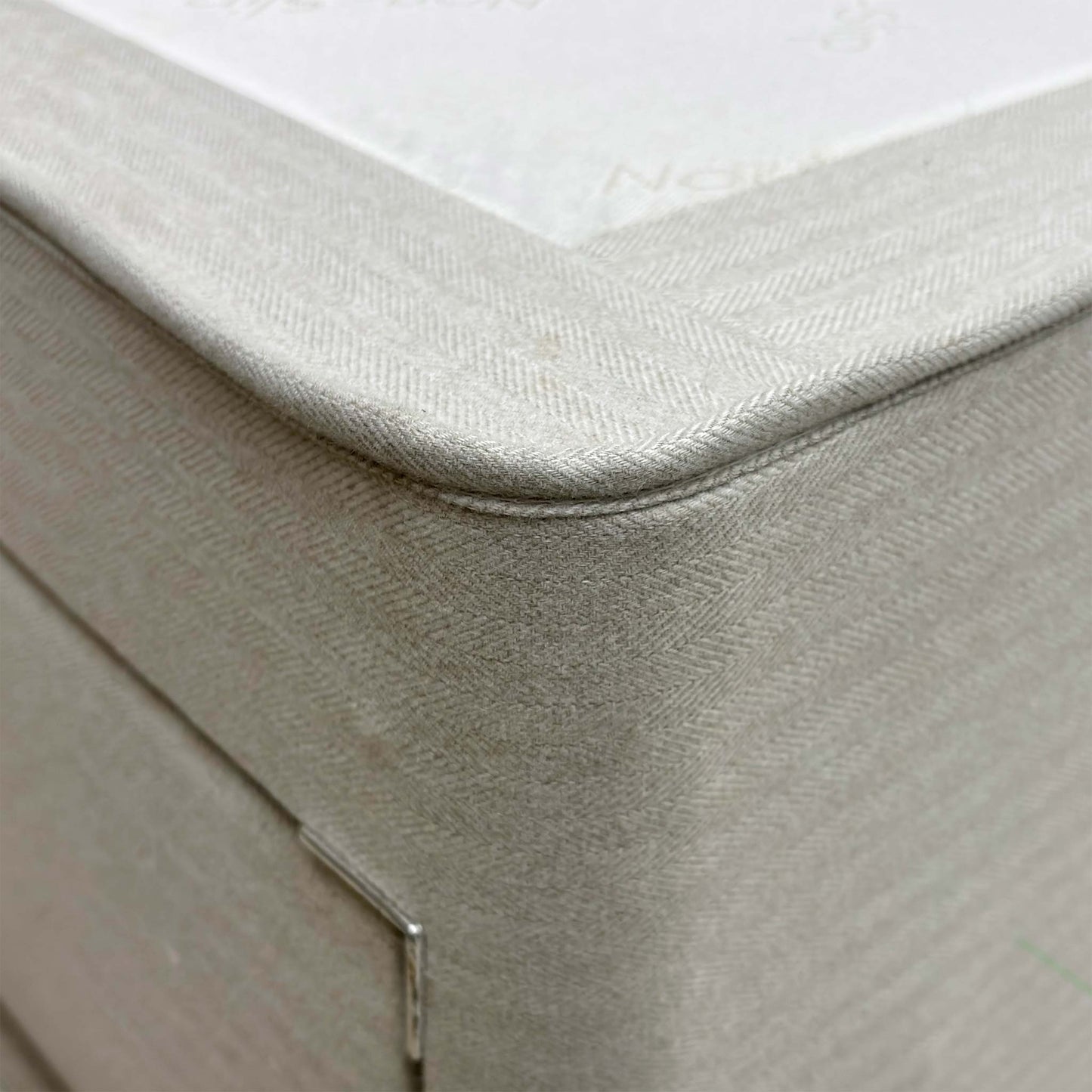 Close-up showing the detail of the tweed stone fabric.