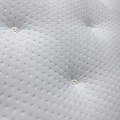 Close-up of the natural damask cover, highlighting the traditional deep button tufting and the soft-touch textured fabric.