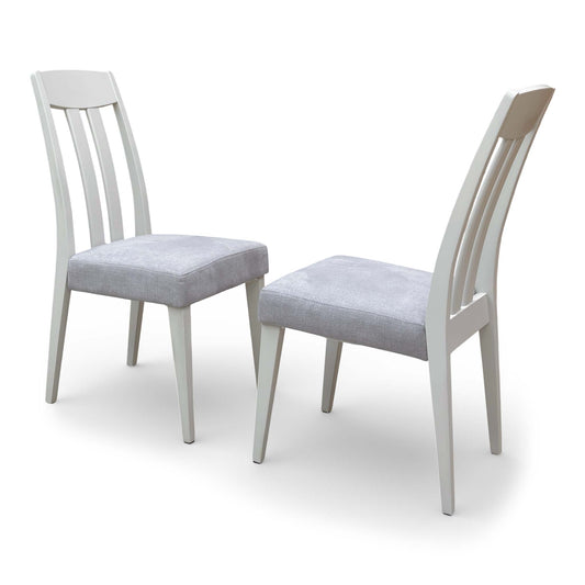 Front view of the 'Niko' dining chair pair, showcasing the grey upholstery and tapered wooden legs.