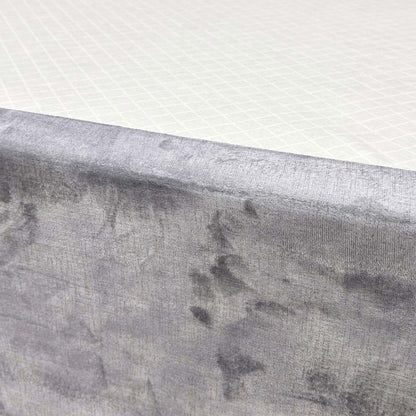 Close-up shot detailing the texture of the Lace Dolphin Velvet upholstery on the 'Sleep Story' bed base.