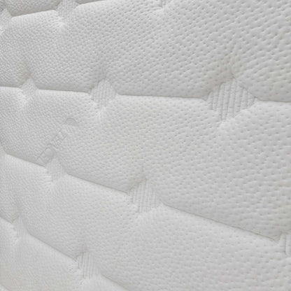 Close-up of the mattress surface texture, highlighting the breathable eco-friendly fabric and quilted patterns.