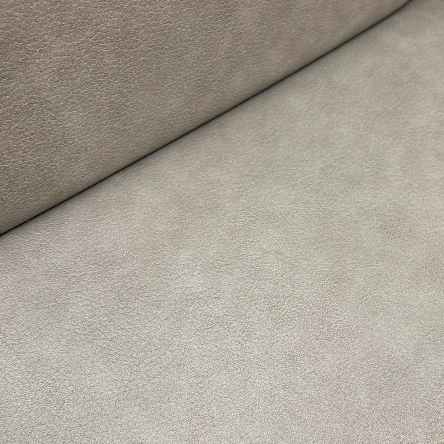 Close-up of the grey upholstery and the glossy wooden frame, emphasizing the premium Italian craftsmanship.