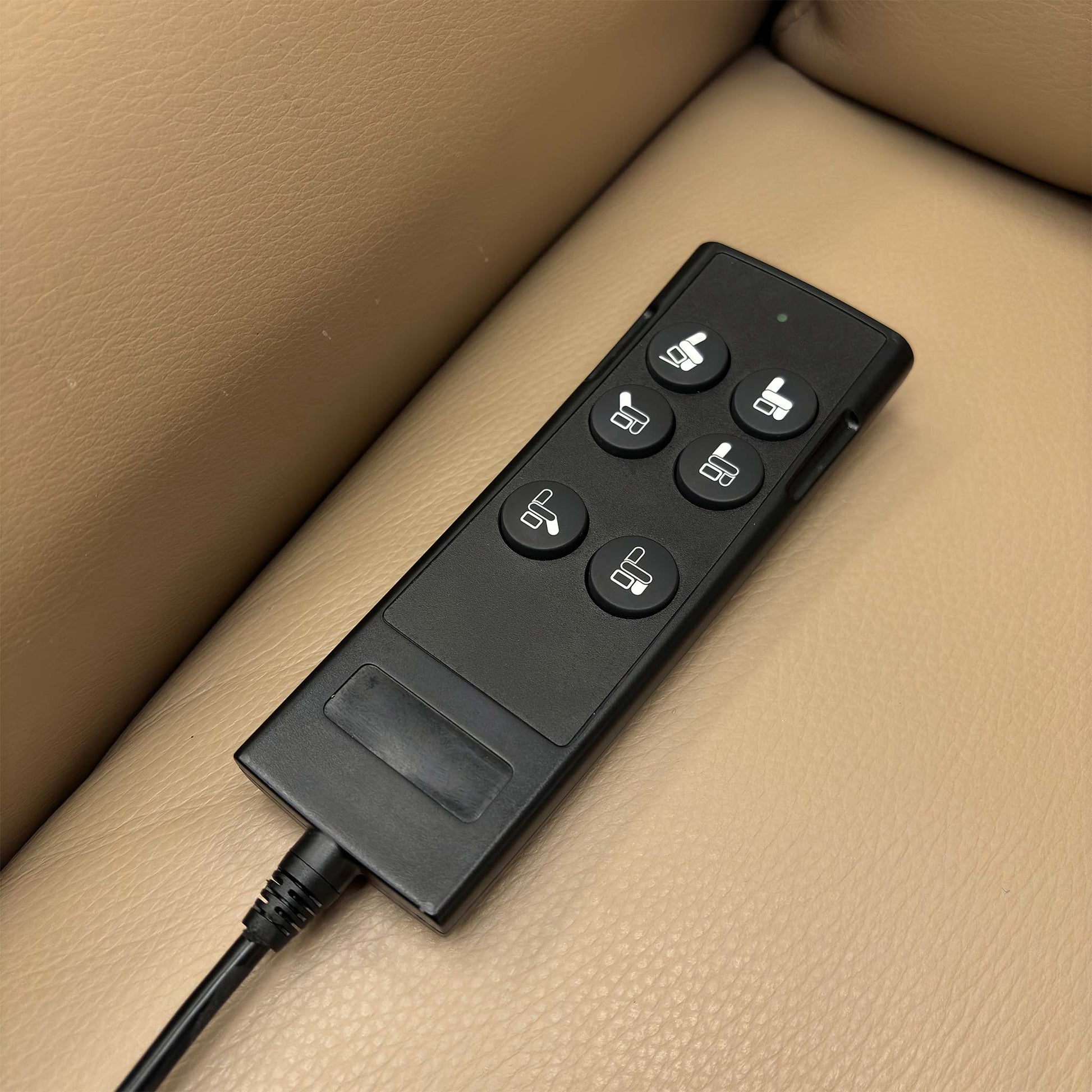 Detailed view of the easy-to-use remote control for the 'Evelyn' chair's power lift and recline functions.