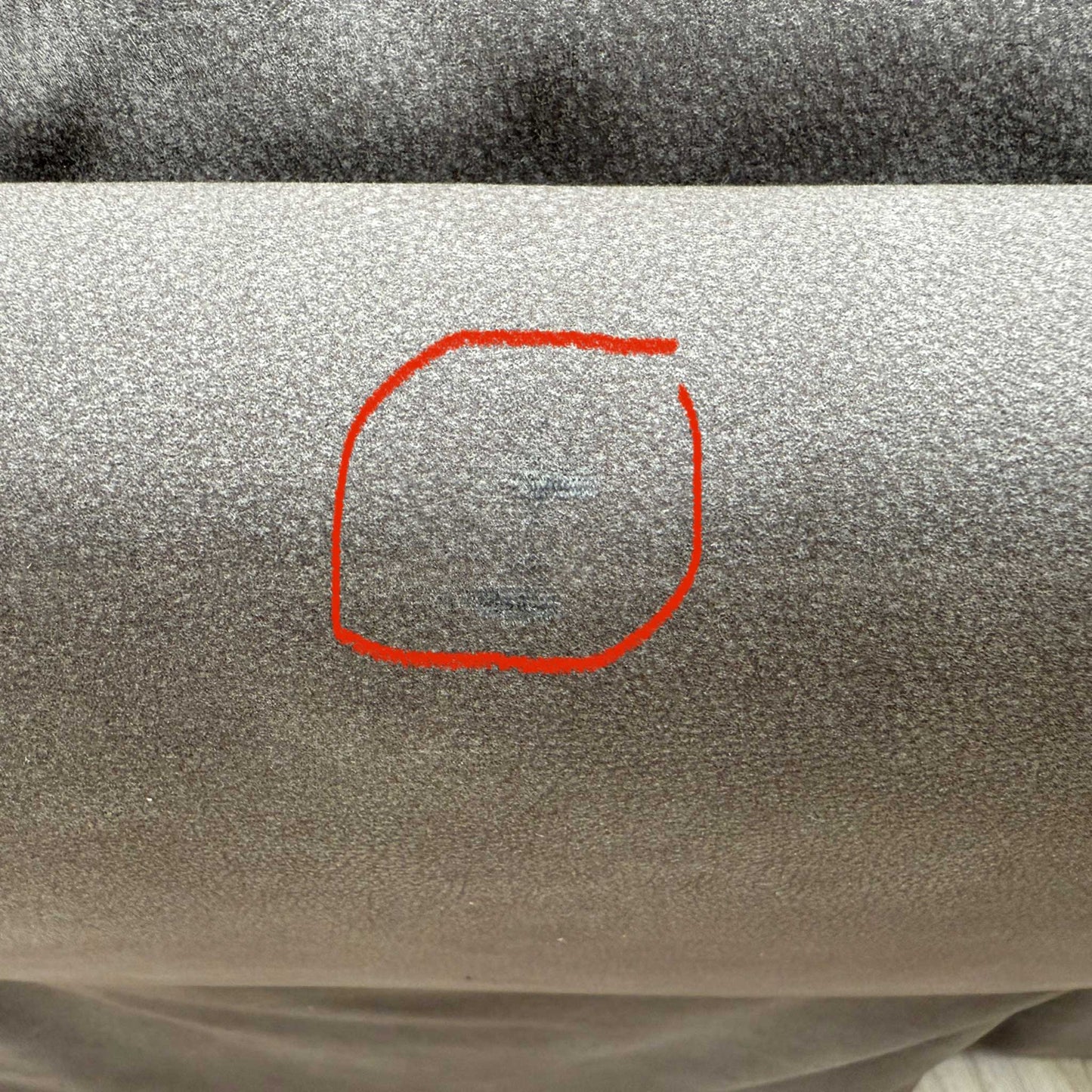 Detailed shot of discoloration on the upholstery and a small cosmetic imperfection on the headrest, neither of which affects comfort, usability, or functionality; please refer to the last photos for details.