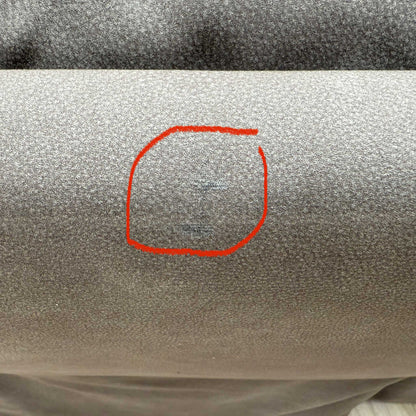 Detailed shot of discoloration on the upholstery and a small cosmetic imperfection on the headrest, neither of which affects comfort, usability, or functionality; please refer to the last photos for details.