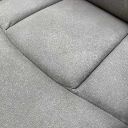 Close-up shot detailing the construction and stitching of the Nappa Grey fabric upholstery.