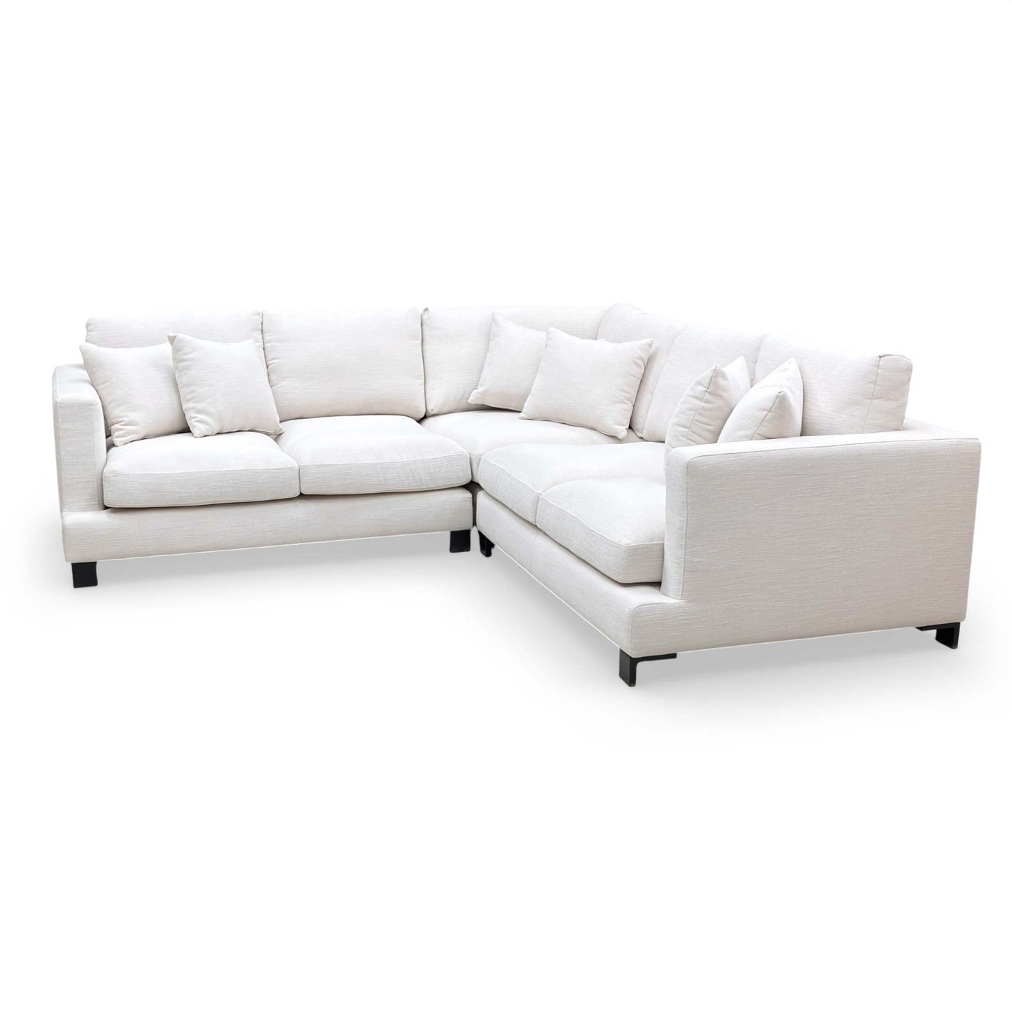 Detail view of the thin black metal feet and the clean lower profile of the sofa.