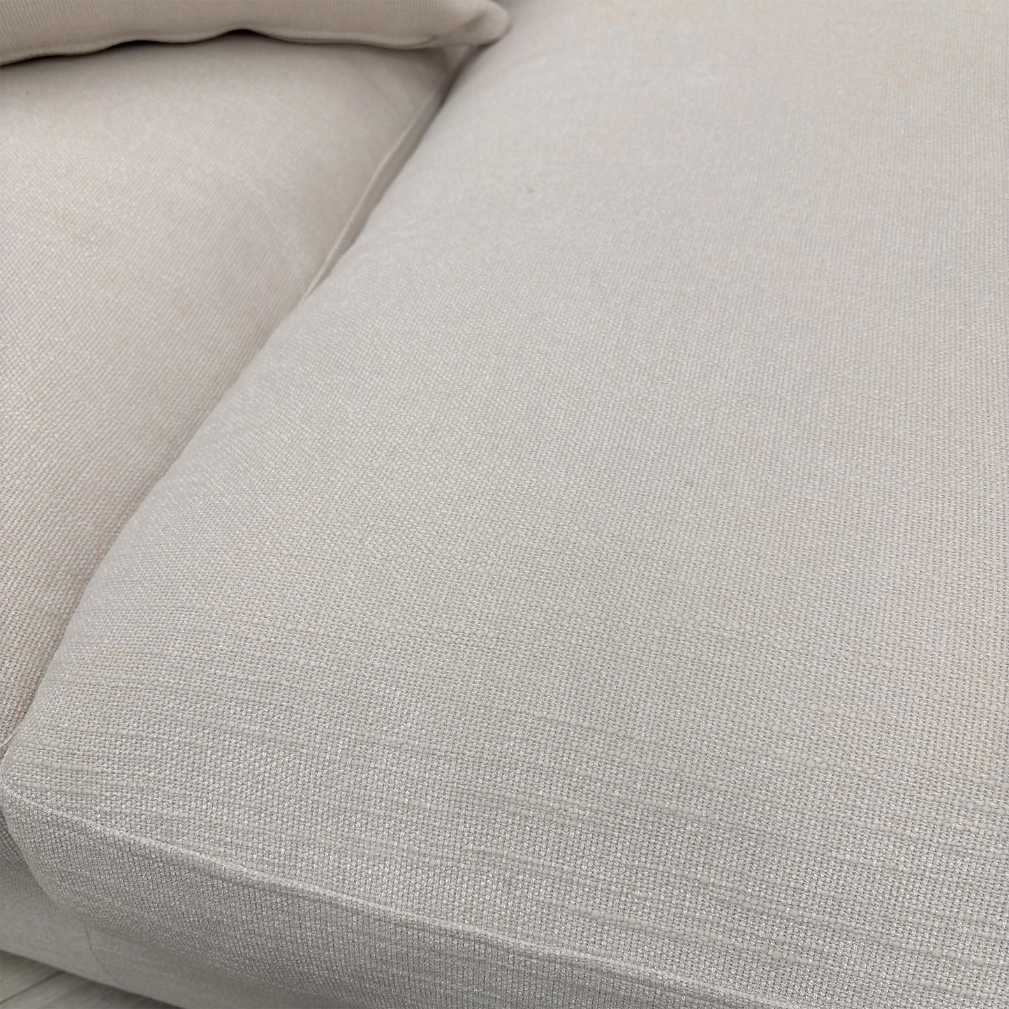 Close-up of the Callida basket weave fabric, highlighting the chunky texture and tonal ivory/cream contrast.