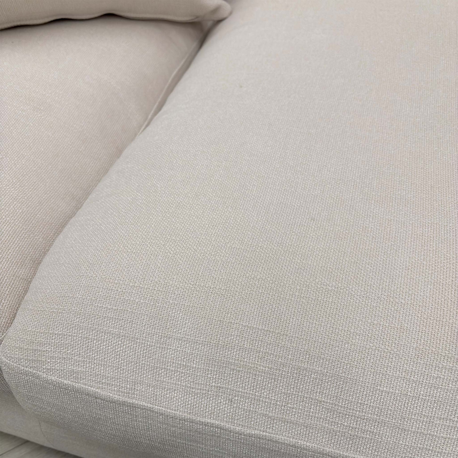 Close-up of the Callida basket weave fabric, highlighting the chunky texture and tonal ivory/cream contrast.