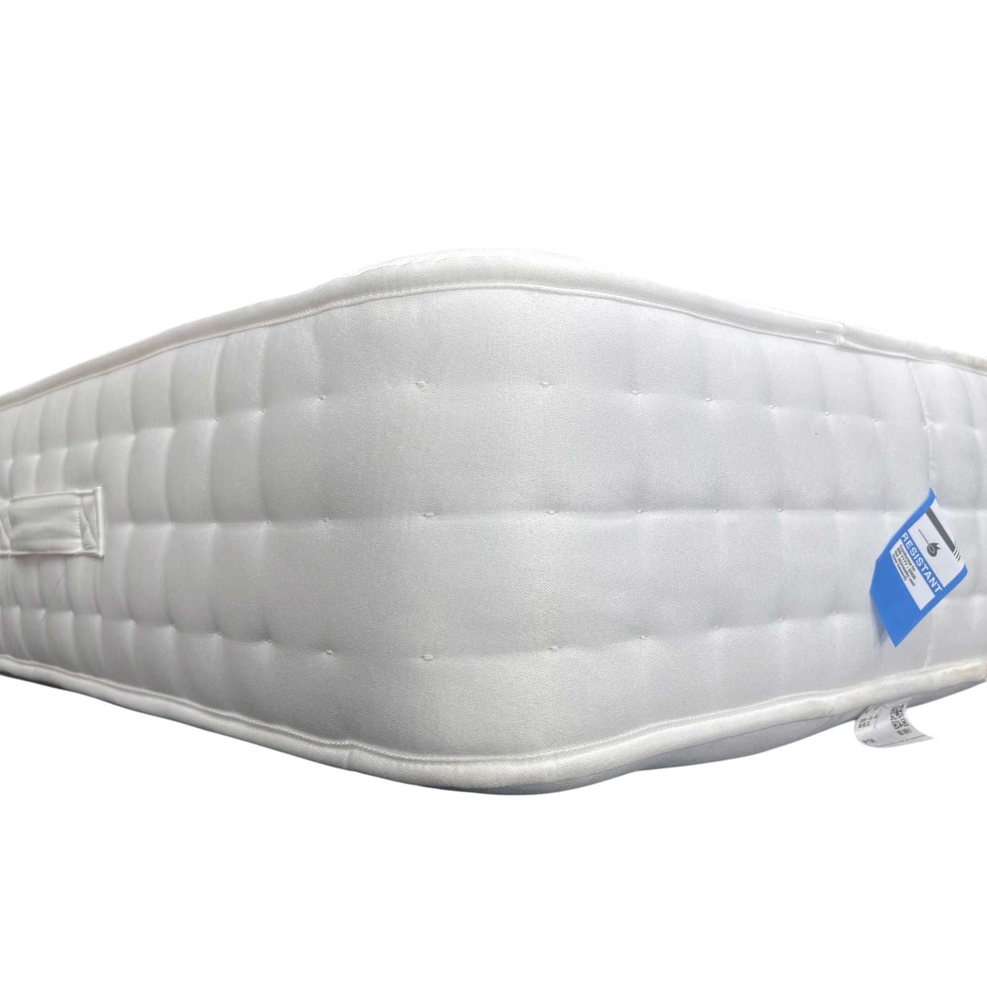 Edge shot of the mattress surface, emphasizing the quilted ortho-support pattern designed for a medium-firm sleeping experience.