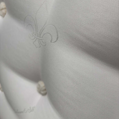 Close up shot of the mattress surface, emphasizing the quilted ortho-support pattern designed for a medium-firm sleeping experience.