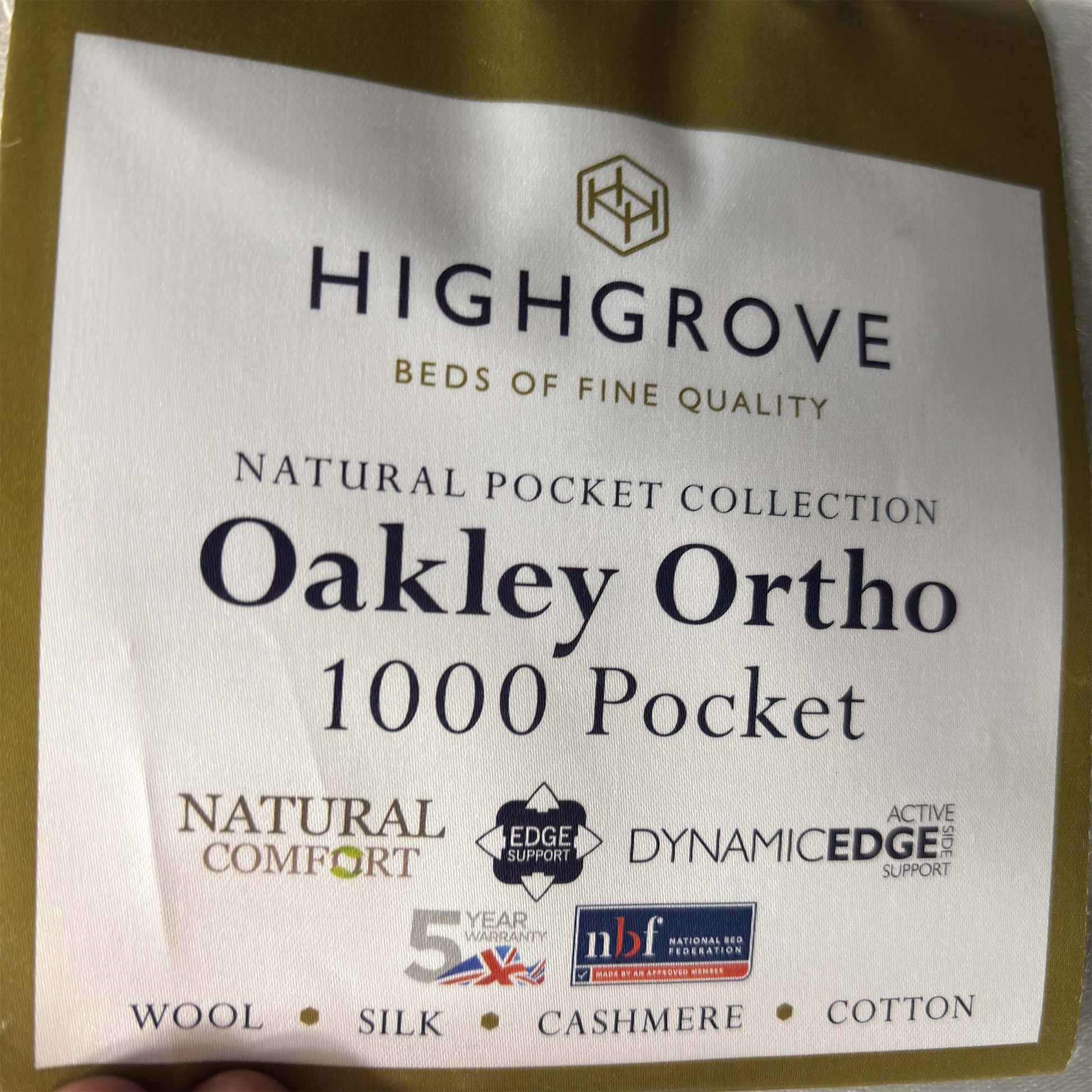 Close up view of ‘Oakley’ Ortho 1000 Pocket Sprung Mattress in single size, featuring a clean white quilted top with a supportive 30cm deep profile.