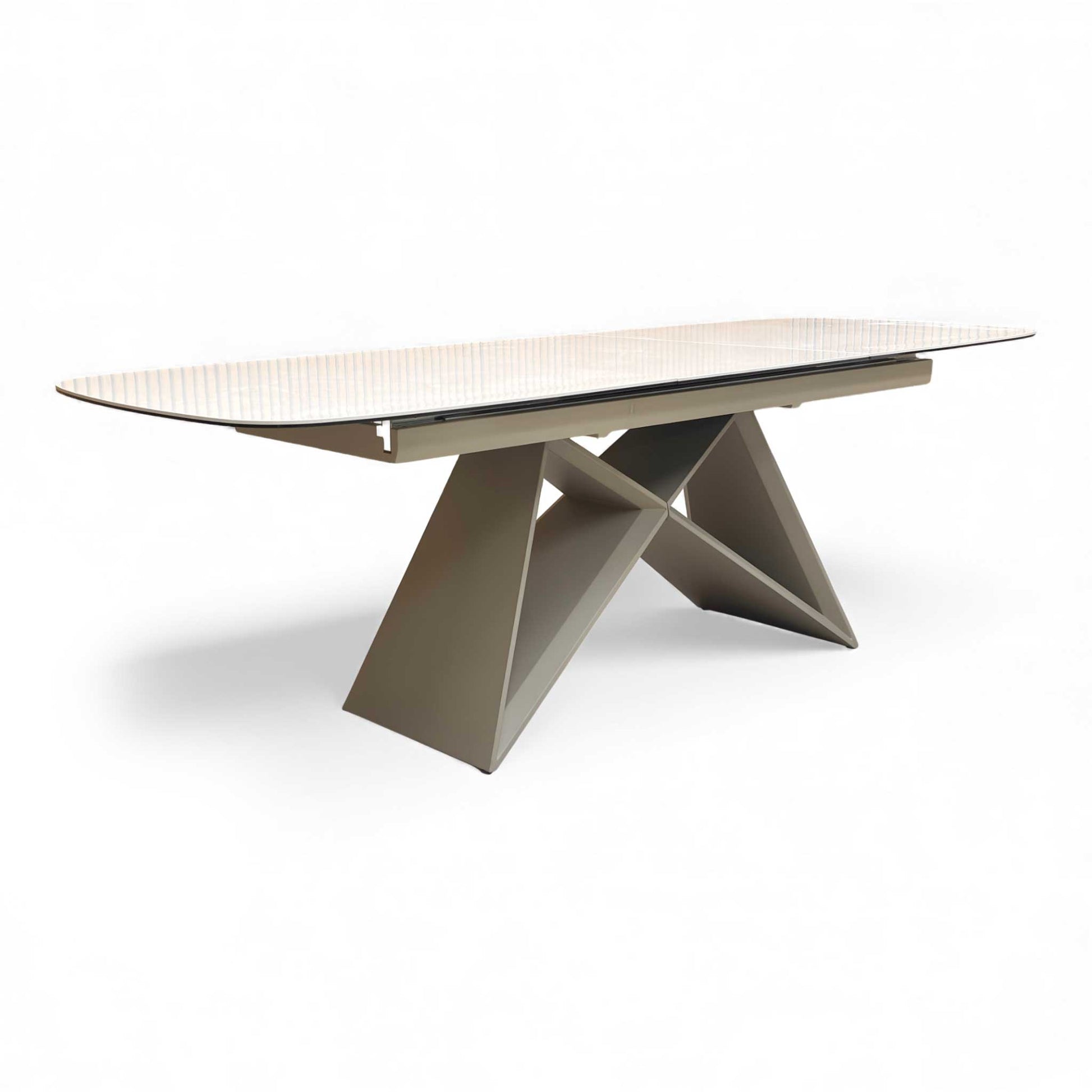 Angled view of the Mirage Ceramic Top Pop-Up 180cm Dining Table with its ceramic surface and modern base.