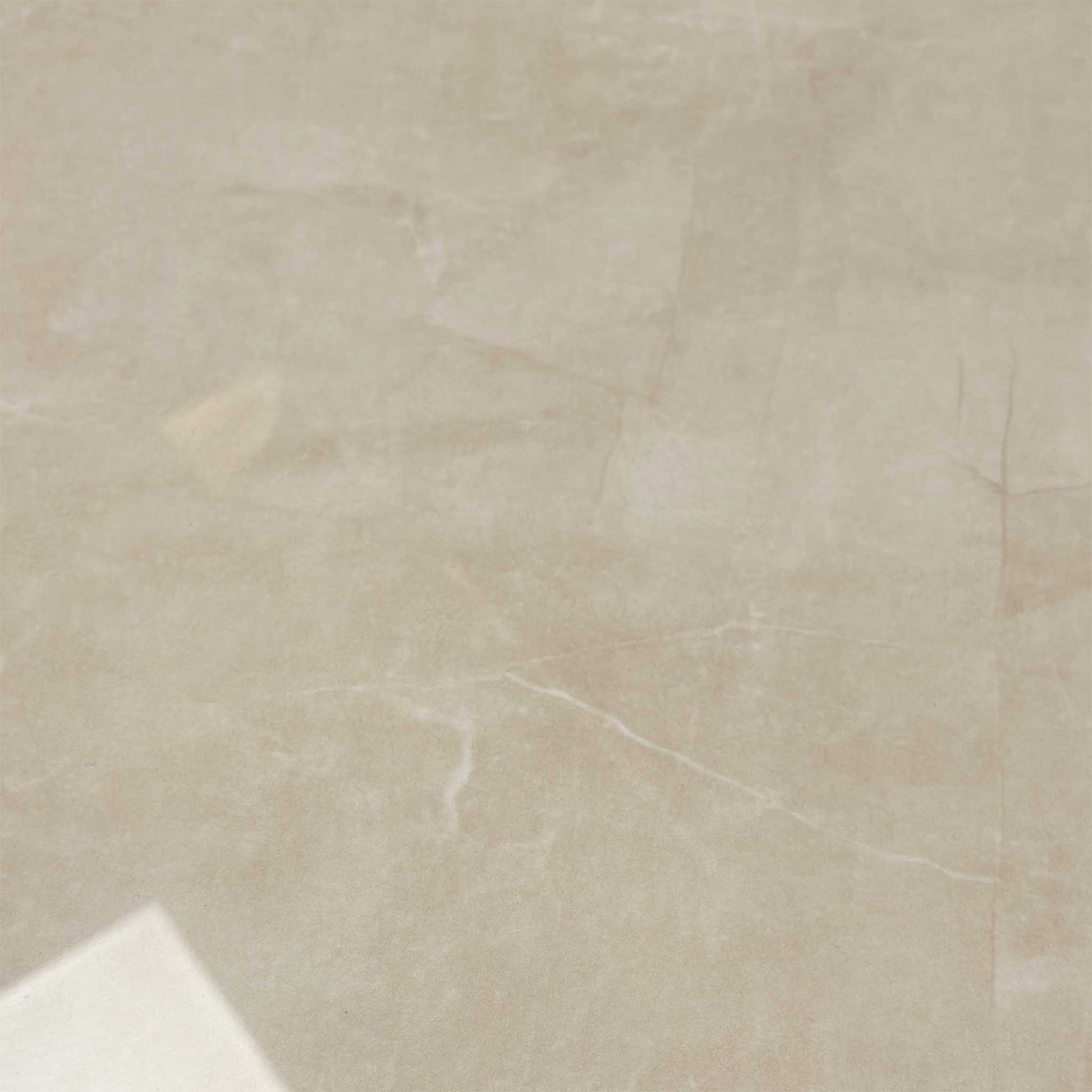 Top-down view of the table with the subtle travertine marble-inspired ceramic finish.