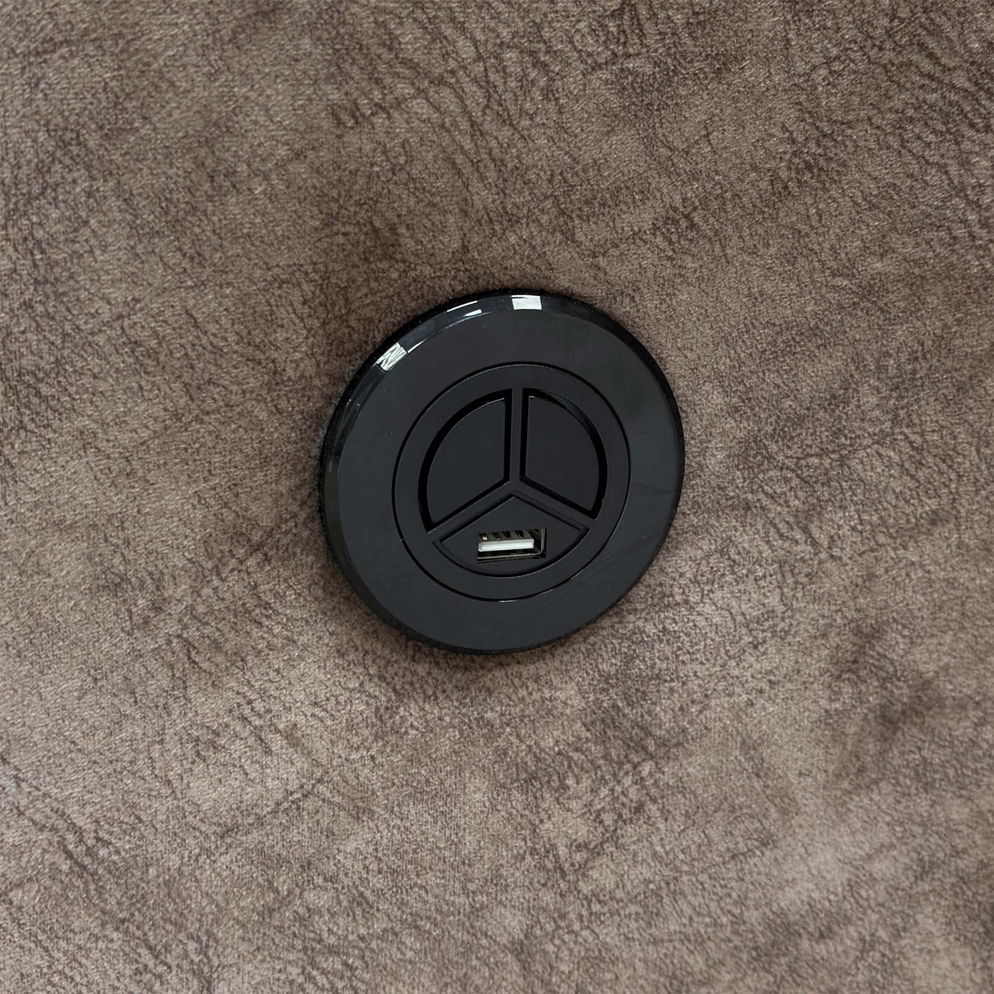 The Electric End Lift Ottoman storage mechanism fully open, revealing the spacious internal storage compartment.