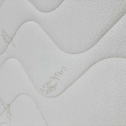 Detailed close-up of the ultra-soft cashmere blend mattress cover, emphasizing the quality of the hypoallergenic sleeping surface.