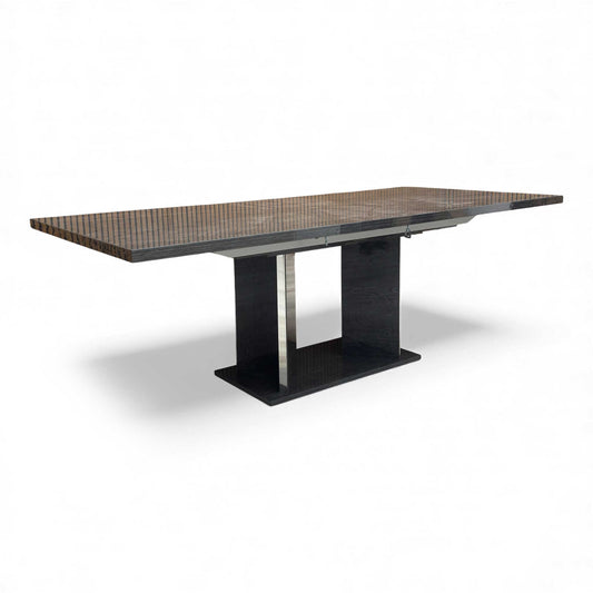 Angled view of the sleek Dark Grey High-Gloss Mia Dining Table, highlighting its modern, clean design.