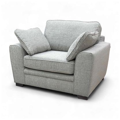 Angled view of the armchair from the back/side, showing its overall profile and depth.