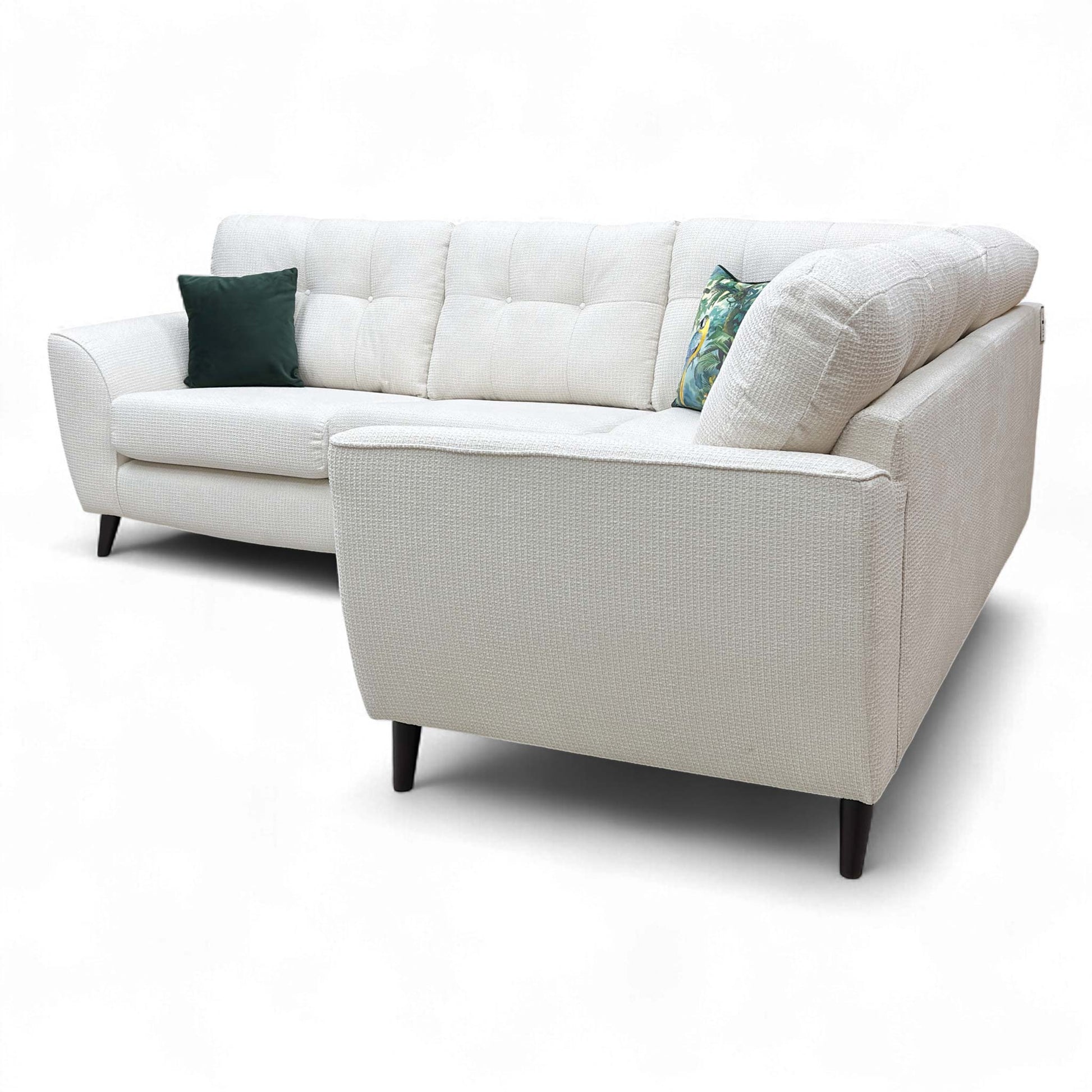 Angled view showing the back of the corner sofa, emphasizing the high back and overall robust shape.
