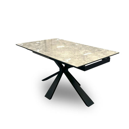 Detailed image of the statement black powder-coated metal base, showing the solid structure that supports the large ceramic tabletop.