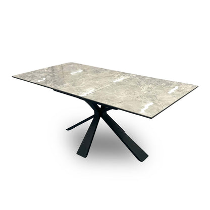 Side view of the table top, focusing on the hidden pop-up extension mechanism with the extra leaf ready to be deployed.